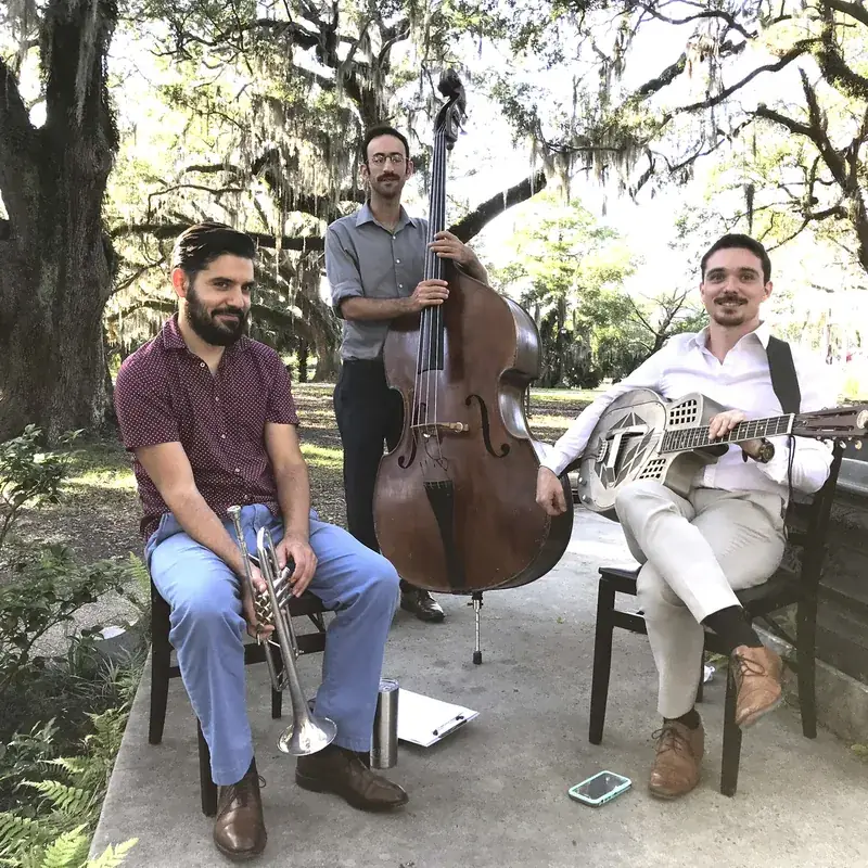 Jazz trio under mossy oaks in New Orleans
